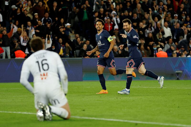 Lionel Messi celebrates with Marquinhos after scoring for Paris Saint-Germain against Lens in their Ligue 1 match at the Parc des Princes on Saturday, April 23, 2022. Reuters