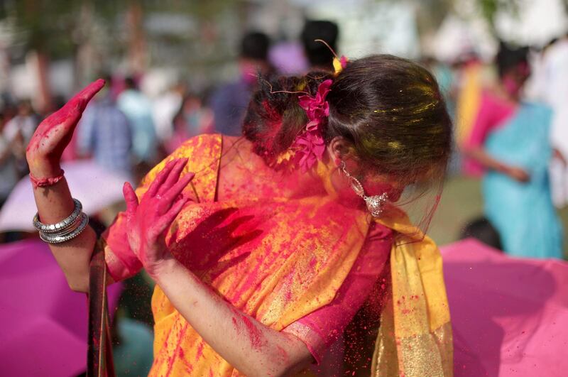 Indian students throw paint over each in Kolkata.   EPA