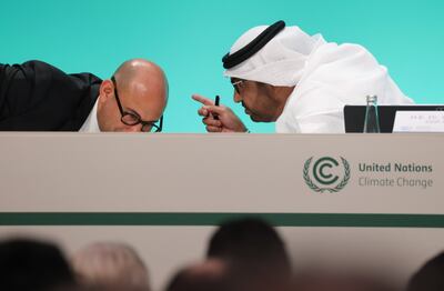 UN climate official Simon Stiell speaks to Cop28 President Dr Sultan Al Jaber at the opening press conference on November 30. Sean Gallup / Getty Images