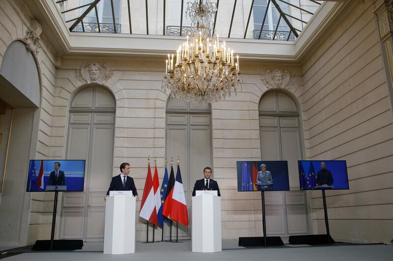 French President Emmanuel Macron, right, and Austrian Chancellor Sebastian Kurz arrive to attend a videoconference with Dutch Prime Minister Mark Rutte, left, German Chancellor Angela Merkel, European Council President Charles Michel, right, and European Commission President Ursula von der Leyen at the Elysee Palace, in Paris, Tuesday, Nov. 10, 2020. The leaders of France, Germany, Austria and the EU are meeting Tuesday to discuss Europe's response to terrorism threats after a string of attacks. Macron and Kurz are meeting in person after both of their countries have lost lives to Islamic extremist attackers in recent weeks. (AP Photo/Michel Euler, Pool)