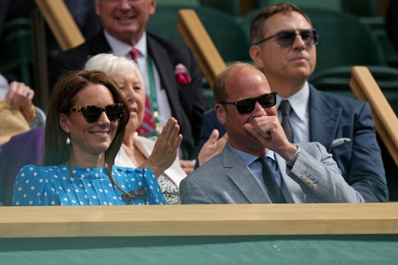 Prince William and Kate, Duchess of Cambridge smile as they sit in the Royal box on Centre Court to watch the quarterfinal match between Novak Djokovic and Jannik Sinner. AP