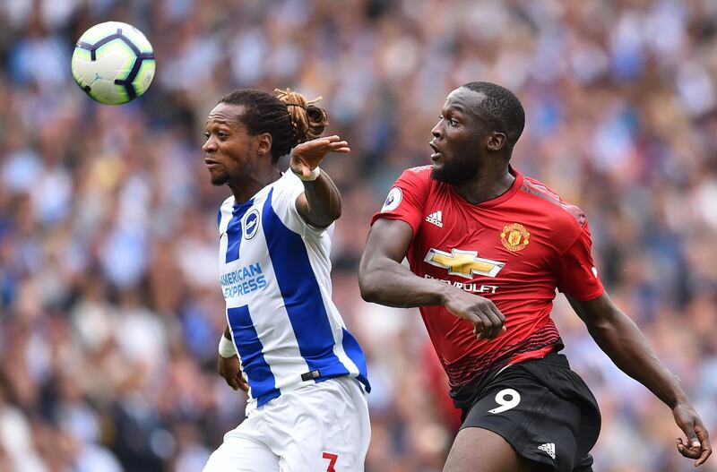 Brighton's Gaetan Bong competes with Manchester United striker Romelu Lukaku for the ball. AFP