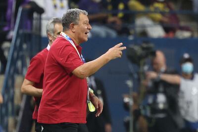 Wahda coach Henk ten Cate watches the action. AFP