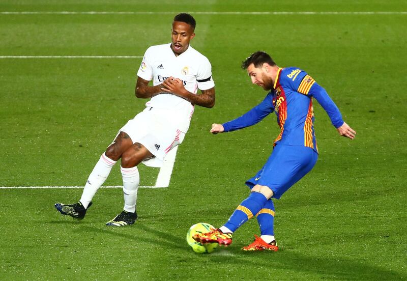 Barcelona's Lionel Messi in action with Real Madrid's Eder Militao. Reuters