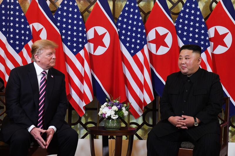 (FILES) In this file photo taken on February 27, 2019 US President Donald Trump (L) listens to North Korea's leader Kim Jong Un during a meeting at the Sofitel Legend Metropole hotel in Hanoi. President Donald Trump on March 22, 2019, abruptly announced the cancellation of sanctions imposed by his own Treasury Department to tighten international pressure on North Korea. "It was announced today by the U.S. Treasury that additional large scale Sanctions would be added to those already existing Sanctions on North Korea. I have today ordered the withdrawal of those additional Sanctions!" Trump said in a tweet. He appeared to be referring to measures unveiled Thursday that targeted two Chinese companies accused of helping North Korea to evade tight international sanctions meant to pressure Pyongyang into ending its nuclear weapons program. But The Washington Post reported, citing Trump administration officials, that the president's tweet referenced future sanctions that had not been announced and were scheduled for "the coming days."
 / AFP / Saul LOEB
