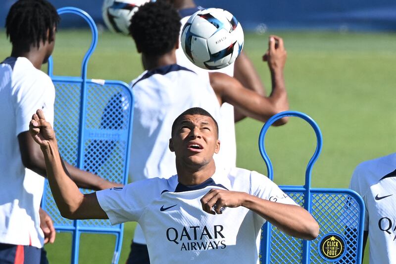 Paris Saint-Germain's French forward Kylian Mbappe heads the ball. AFP