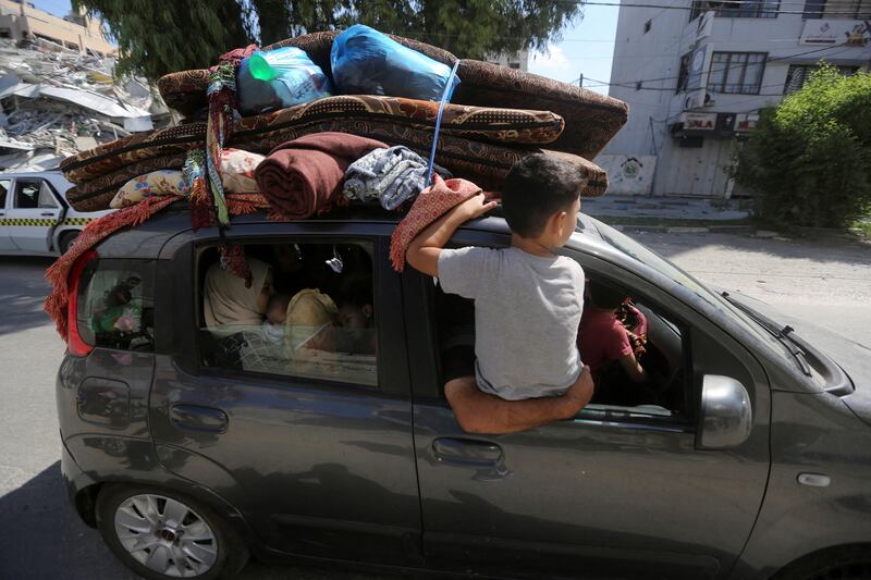 Palestinians flee their houses heading toward the south after the Israeli army warned people to leave the northern Gaza Strip. Reuters