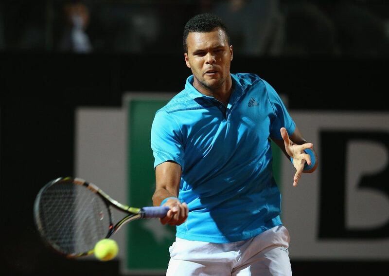  Jo-Wilfried Tsonga in action against Alexandr Dolgopolov the first round of the Rome Masters on Monday. Julian Finney / Getty Images / May 12, 2014  