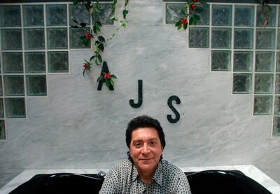 In this June 19, 2004 photo Alec John Such sits for a portrait inside his second floor bathtub. NJ Advance Media via AP