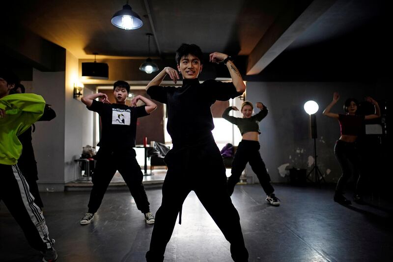Xiong Daiki, 22, teaches dance at a studio, almost a year after the global outbreak of the coronavirus in Wuhan, China, on December 13, 2020. Reuters