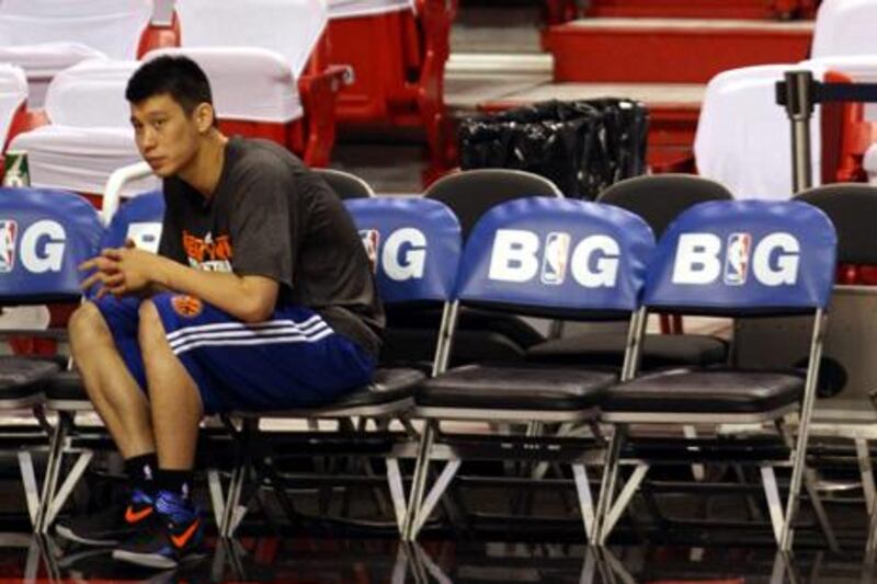 MIAMI, FL - MAY 09: Guard Jeremy Lin of the New York Knicks watches work outs prior to his team taking on the Miami Heat in Game Five of the Eastern Conference Quarterfinals in the 2012 NBA Playoffs on May 9, 2012 at the American Airines Arena in Miami, Florida. NOTE TO USER: User expressly acknowledges and agrees that, by downloading and or using this photograph, User is consenting to the terms and conditions of the Getty Images License Agreement.   Marc Serota/Getty Images/AFP== FOR NEWSPAPERS, INTERNET, TELCOS & TELEVISION USE ONLY ==

