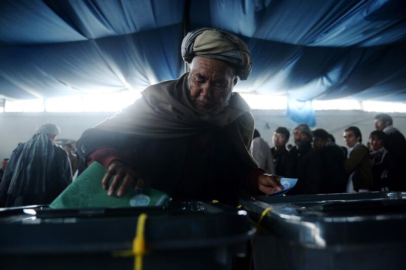 A man casts his vote at a local polling station in Kabul. April 5, 2014. Shah Marai / AFP