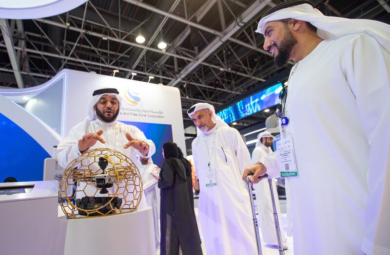 A Dubai Customs official explains the latest in surveillance technology at the agency's stand. 