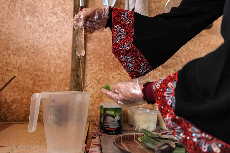 Ms Badwan extracts oil to make soap at her home in Deir Al Balah