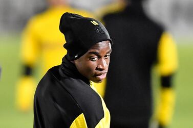 Dortmund's Youssoufa Moukoko watches during a training session prior the Champions League group F soccer match between Borussia Dortmund and Club Brugge in Dortmund, Germany, Monday, Nov. 23, 2020. The 16-year old forward Youssoufa Moukoko could become the youngest player ever in the Champions League on Tuesday. (AP Photo/Martin Meissner)