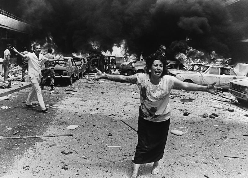 A woman cries in shock, minutes after a car bomb exploded in a crowded neighborhood of mainly-Moslem West Beirut 08 August 1986, killing 13 people, including three children, and injuring at least 92. The Lebanese civil war broke out 20 years ago in April 1975. AFP PHOTO KHALIL DEHAINI (Photo by KHALIL DEHAINI / AFP)