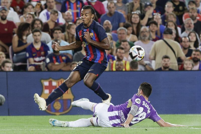 Jules Kounde challenges for the ball against Real Valladolid defender Sergio Escudero. EPA