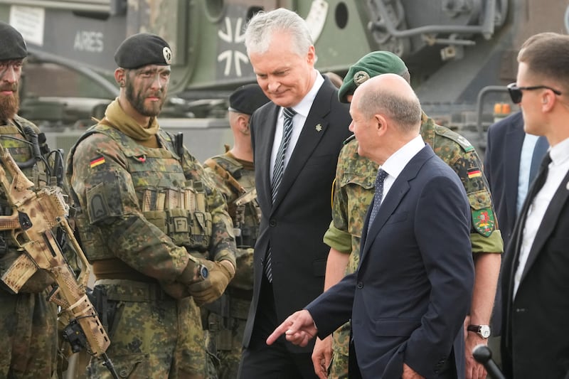 German Chancellor Olaf Scholz (R) and Lithuanian President Gitanas Nauseda visit German troops in Pabrade, Lithuania. Reuters