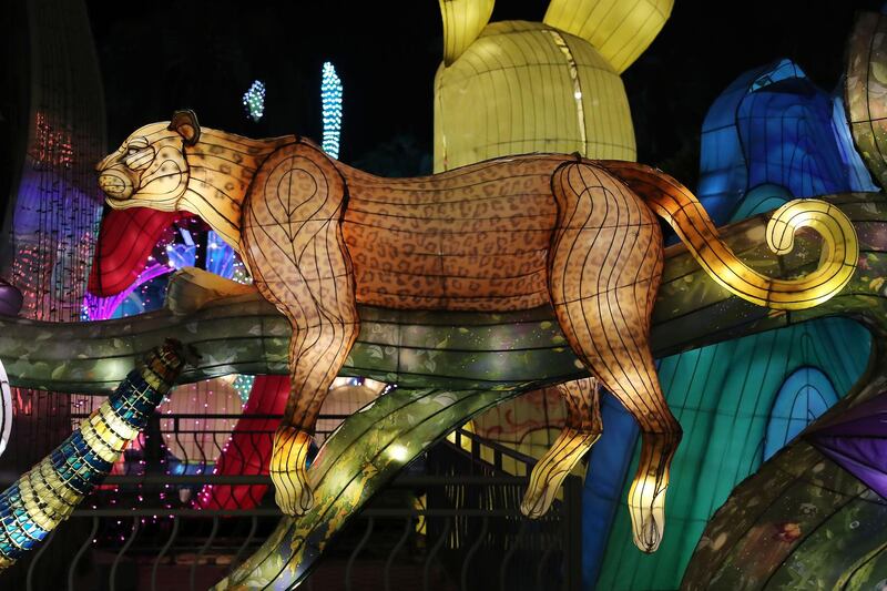 DUBAI, UNITED ARAB EMIRATES , October 14 – 2020 :- View of the colourful light figures at the Dubai Garden Glow season 6 which opened on 12th October at the Zabeel park in Dubai. No sitting allowed on the benches as a precautionary measure against the spread of coronavirus. Security at the entrance gate checks the body temperature of all the visitors. (Pawan Singh / The National) For Life Style/Online/Instagram/Big Picture. Story by Evelyn Lau