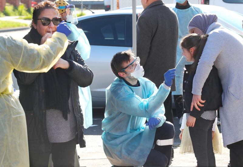 Medical workers collect a swab sample during community Covid-19 testing in Broadmeadows, Melbourne, Australia.   EPA