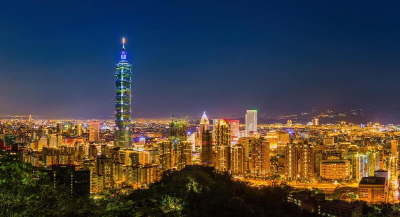 Aerial panorama of Taipei City at dusk, with a view of Taipei 101. Getty Images
