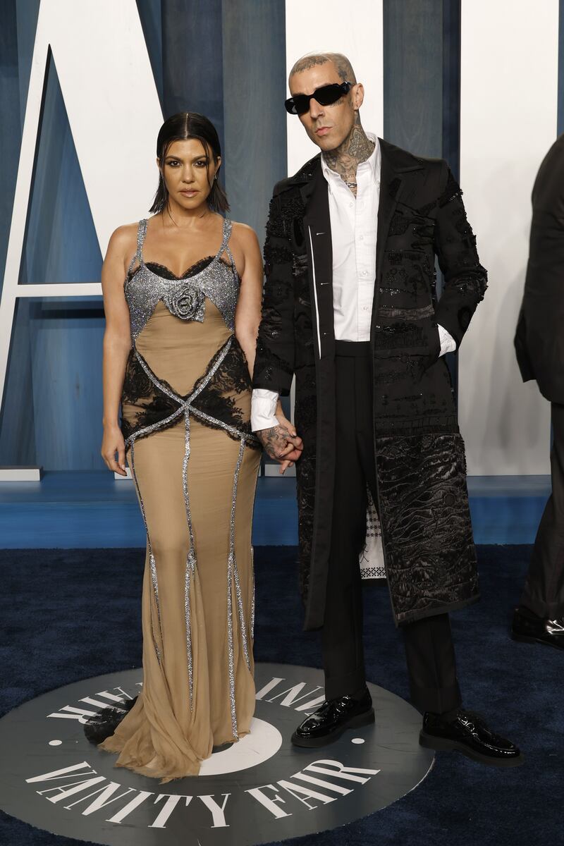 Kourtney Kardashian and Travis Barker attend the Vanity Fair Oscar Party. AFP