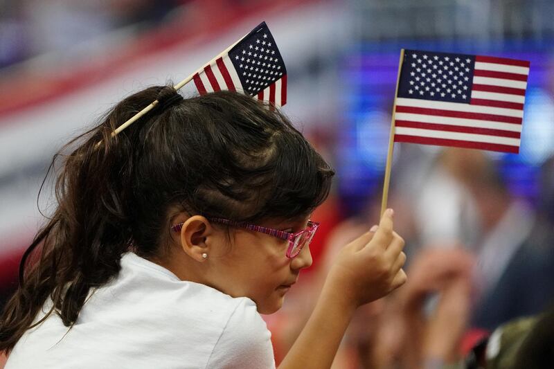 People wait before Donald Trump speaks at a campaign kick off rally at the Amway Center in Orlando, Florida.  Reuters