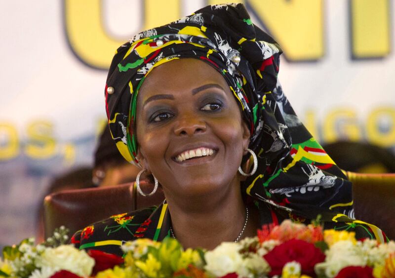 FILE - In this Dec. 16, 2016, file photo, Zimbabwean first lady Grace Mugabe attends a ruling ZANU PF Party Conference in Masvingo, Zimbabwe. Zimbabwean state media said Sunday, Aug. 20, 2017, the wife of President Robert Mugabe returned home from South Africa despite calls that she be prosecuted for allegedly assaulting a young model at a luxury hotel in Johannesburg. (AP Photo/Tsvangirayi Mukwazhi, File)