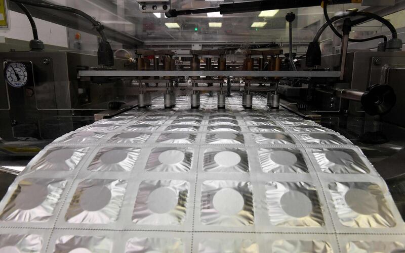 (FILES) In this file photo taken on March 29, 2018 tablets are pictured on the production line of Bristol Myers Squibb's pharmaceutical plant of French group UPSA (Union de pharmacologie scientifique appliquee) in Agen, southwestern France.  Japanese laboratory Taisho Pharmaceutical has made an offer to buy the French laboratory Upsa, specialised in non-prescription drugs, for $ 1,6 billion (1,4 billion euros), announced the American Bristol Myers-Squibb, the current owner of Upsa, in favour of this sale, on December 19, 2018. A definitive agreement has yet to be reached, BMS added in a statement. / AFP / GEORGES GOBET
