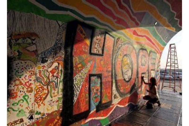 The Global Youth Empowering Movement organised a three-day event where participants painted graffiti style artwork onto a tunnel under the theme of 'building hope', at the Festival Centre in Dubai. Pictured is Alice Pargiter, 19 years old.