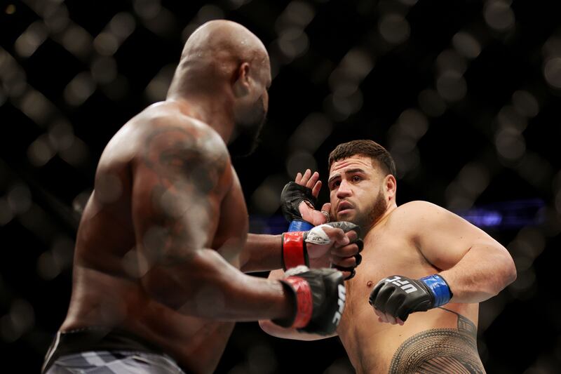 Tai Tuivasa and Derrick Lewis in their heavyweight fight at UFC 271. AFP