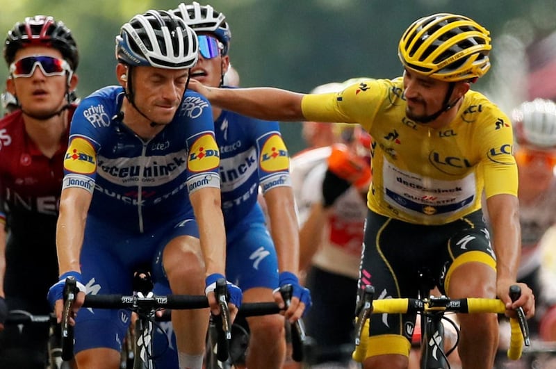 Cycling - Tour de France - The 200-km Stage 17 from Pont du Gard to Gap - July 24, 2019 - The peloton, with Deceuninck-Quick Step rider Julian Alaphilippe of France wearing the overall leader's yellow jersey and Team INEOS rider Geraint Thomas of Britain, finishes. REUTERS/Gonzalo Fuentes
