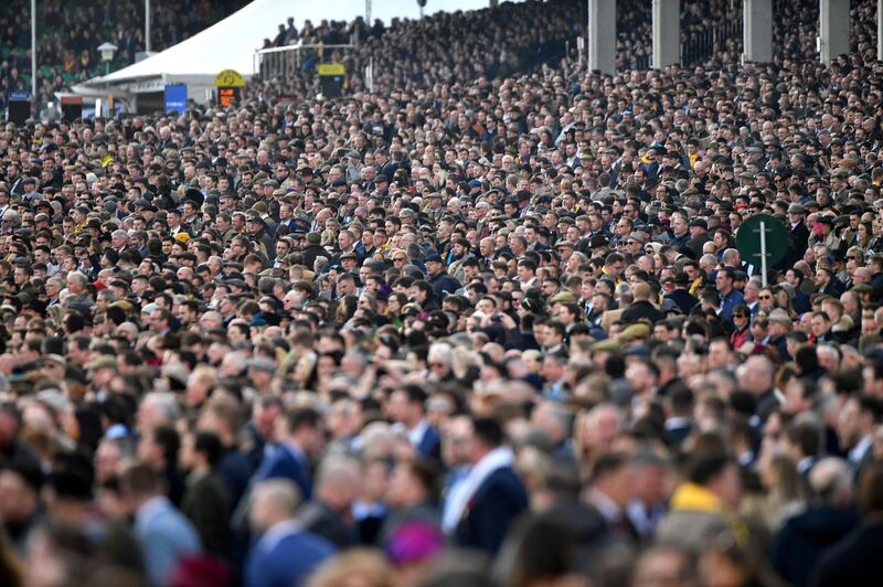 File photo dated 13-03-2020 of Racegoers watching the JCB Triumph Hurdle during day four of the Cheltenham Festival at Cheltenham Racecourse. PA Photo. Issue date: Wednesday April 22, 2020. The decision to suspend professional football in England before the Government formally banned mass gatherings due to the coronavirus pandemic was a potential lifesaver, according to an epidemiologist. See PA story SPORT Coronavirus  Epidemiologist.  Photo credit should read Jacob King/PA Wire.