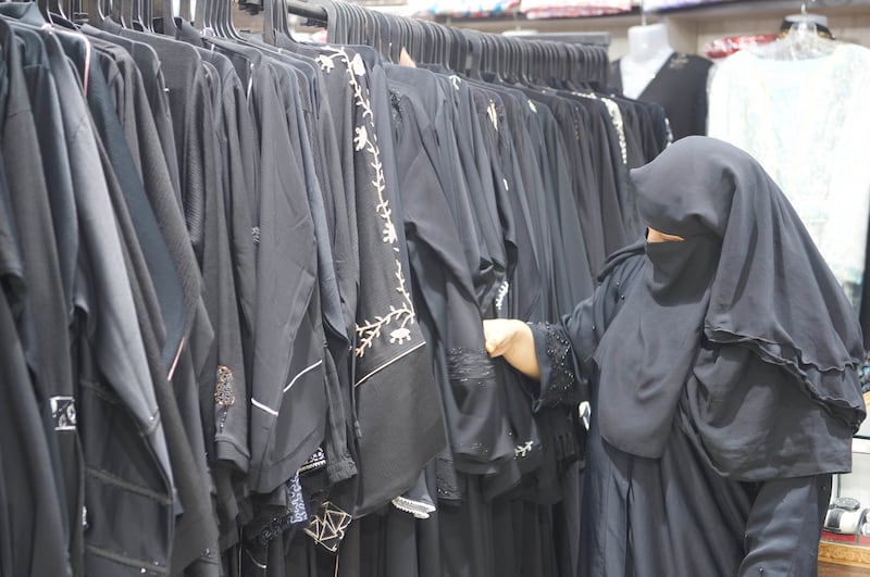 Bushra Bafa, 39, a mother of three teenagers, buying a burqa. Her grandfather came from Yemen and she has infused Indian and Arabic traditions to raise her children