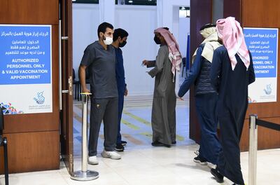People arrive to obtain booster Covid-19 vaccine doses at a vaccination centre in Kuwait City. Photo: EPA