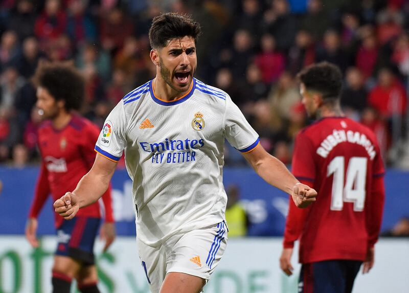 Marco Asensio celebrates after scoring Real Madrid's second goal against Osasuna. AFP