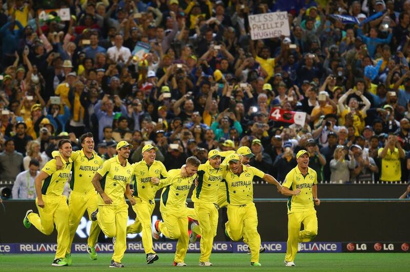 Australia players charge onto the pitch after winning the 2015 cricket World Cup. Mark Kolbe / Getty Images