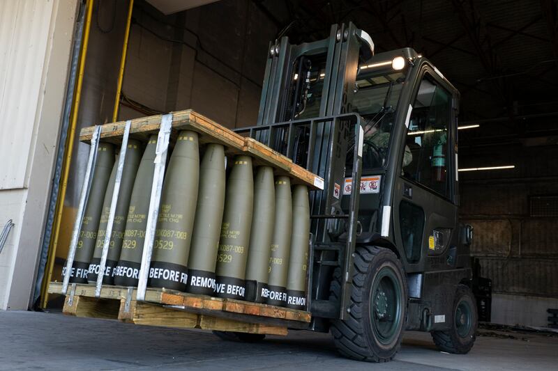 An airman at Dover Air Force Base in Delaware moves 155mm shells bound for Ukraine last year. AP