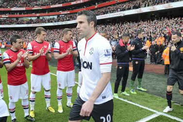 Manchester United's Robin van Persie walks through Arsenal's guard of honour in 2013. Getty