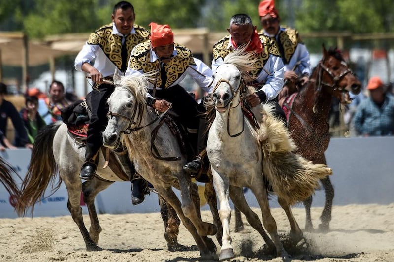 Horseriders practising the traditional Central Asian sport Kok-boru, know also as Buzkashi or Ulak Tartis (goat grabbing) on May 11, 2017, during the Ethnosports Culture Festival in Istanbul. Some 800 athletes gathered in Istanbul for the festival aimed at promoting ancient Turkish sports. Ozan Kose/AFP