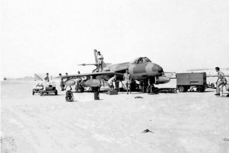 With no hangar available in the 1960s, all servicing at Sharjah's airbase was carried out under a scorching sun as with the undercarriage checks seen here. Courtesy of Ray Deacon