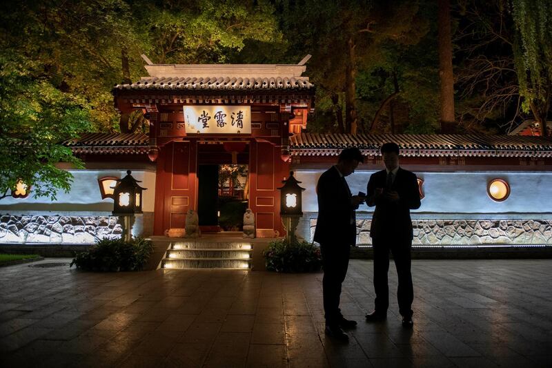 Two security guards secure an area as China's Foreign Minister Wang Yi (not seen) meets for talks with his French counterpart Jean-Yves Le Drian (not seen) at Diaoyutai State Guesthouse in Beijing, China.  Reuters