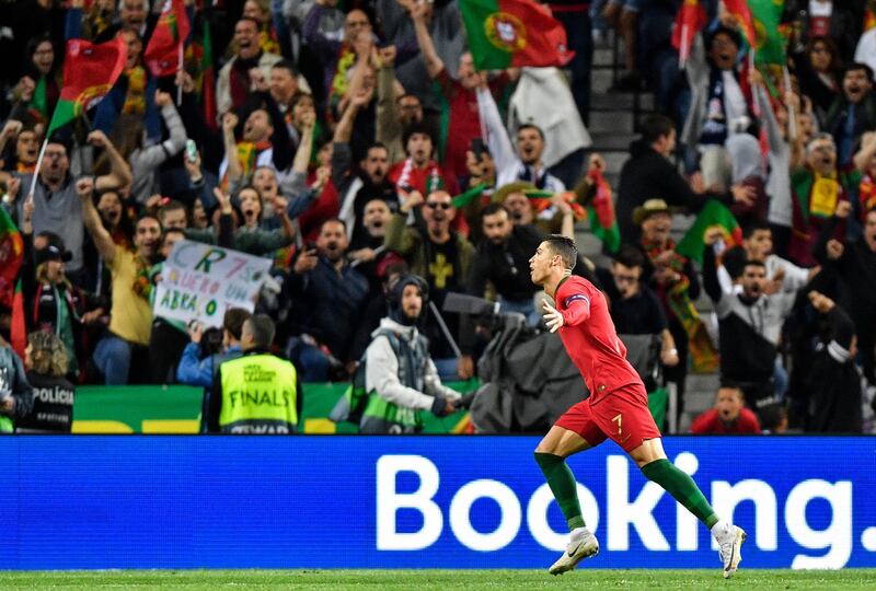 Ronaldo celebrates in front of supporters. AP Photo
