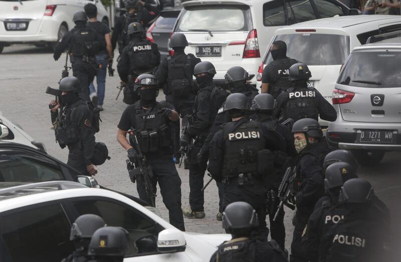 Police officers are deployed near the site. Dita Alangkara / AP Photo