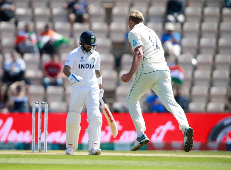 New Zealand's Kyle Jamieson, right, celebrates the dismissal of India's captain Virat Kohli. AP