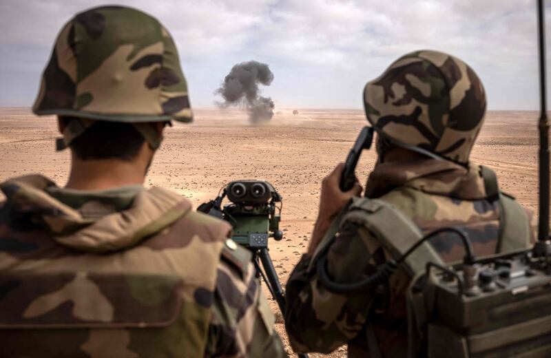 Troops watch an explosion in south-western Morocco.