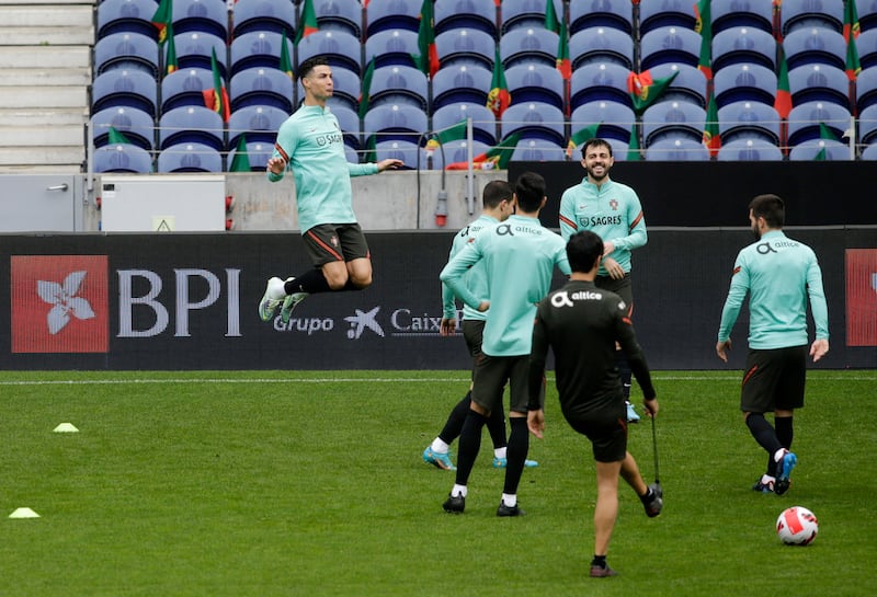 Cristiano Ronaldo leaps at training with his Portugal teammates. Reuters