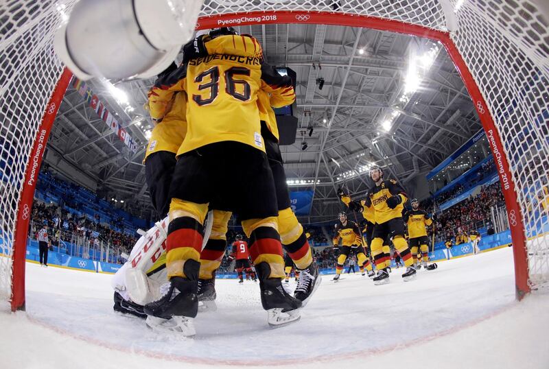 GANGNEUNG, SOUTH KOREA - FEBRUARY 23: Team Germany celebrate after the semifinal round of the men's hockey game against Canada at the 2018 Winter Olympics on February 23, 2018 in Gangneung, South Korea.  (Photo by Julio Cortez - Pool/Getty Images)