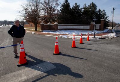 A police officer blocks the entrance to Bridgewater College following a shooting on campus. AP