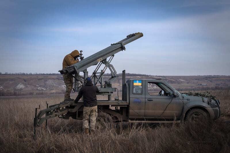 Ukrainian soldiers prepare to fire rockets near Bakhmut in the Donetsk region. AP